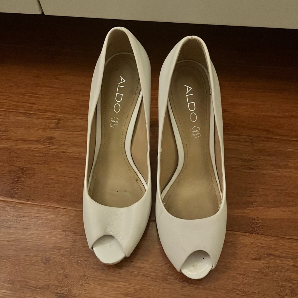 Barely worn Aldo white high heels in size 7